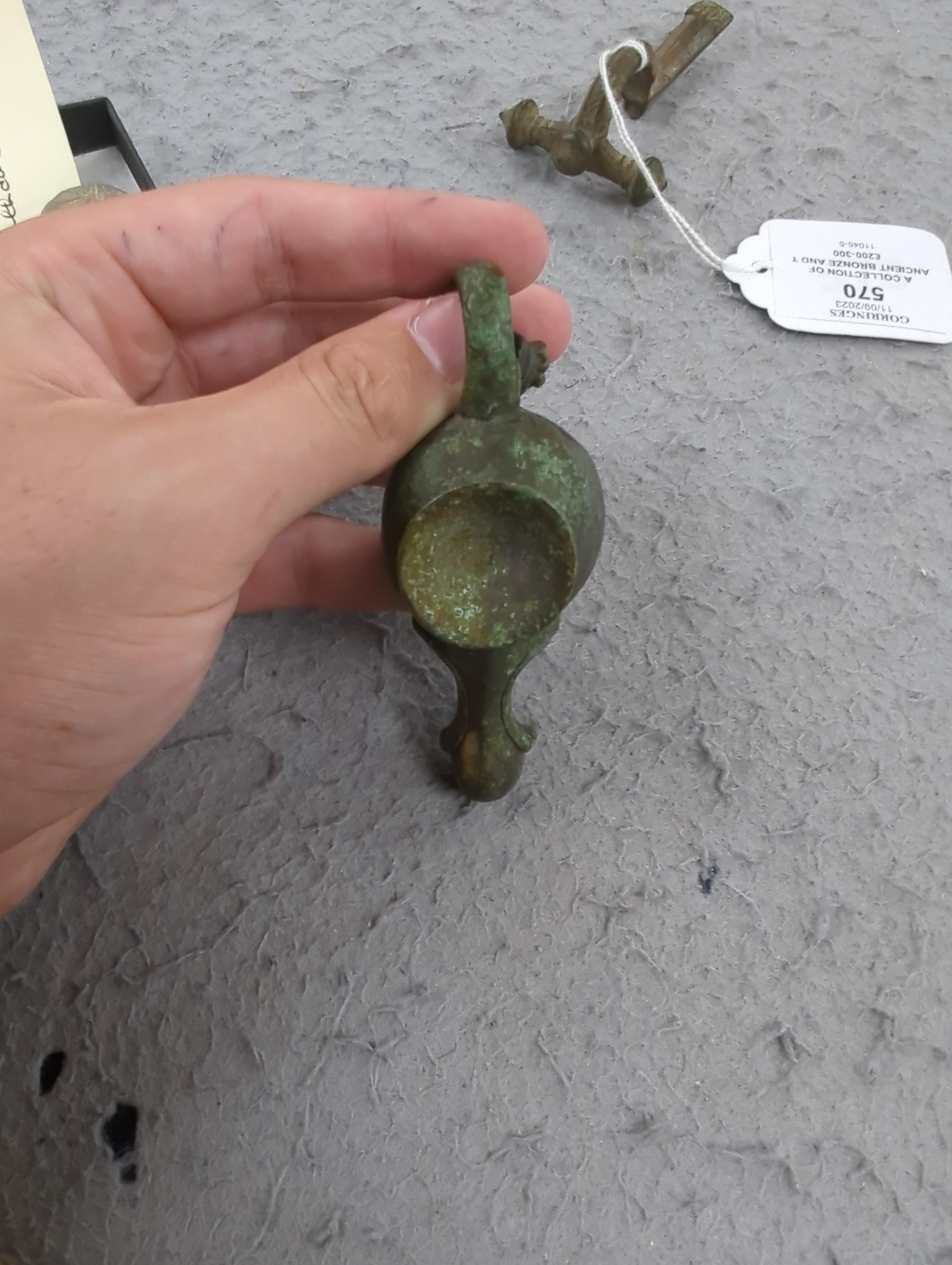 A collection of ancient bronze and terracotta items